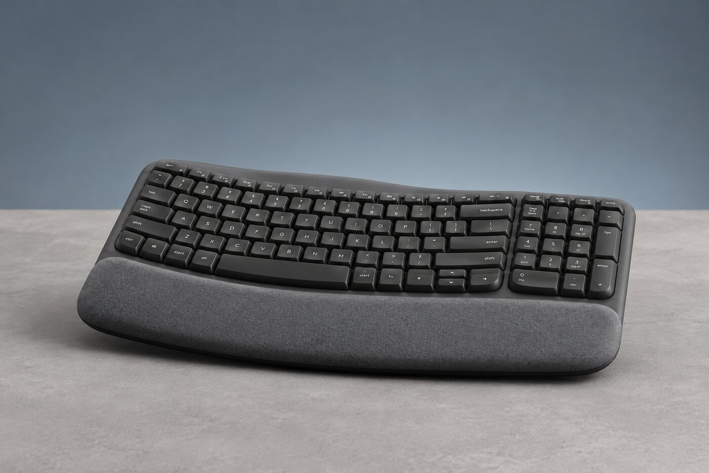 Low side view showing the Wave Keys curved profile and cushioned palm rest